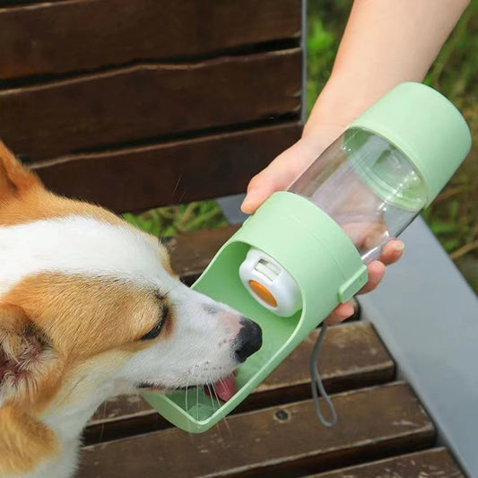 Green portable 500ml pet water bottle and food dispenser.